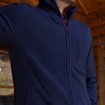 Man wearing Apex Full Zip over a woven shirt